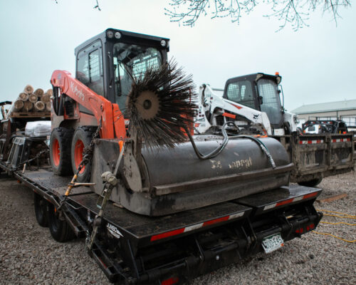 Tractor loaded onto a trailer